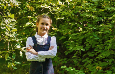 Schoolgirl smiling in white clothes