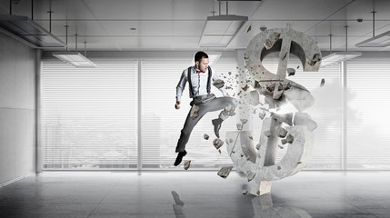 Businessman destroying dollar . Mixed media