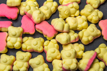Gummy bears sweet candy on black background