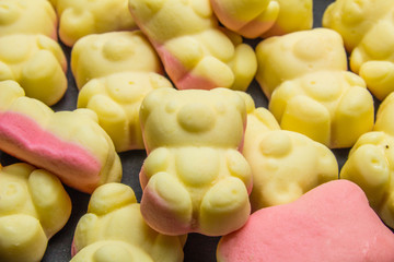 Gummy bears sweet candy on black background