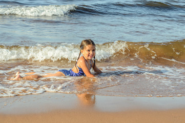 Girl playing on the beach