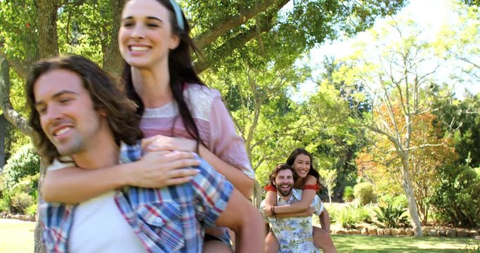 Hipster men holding their girlfriend and running