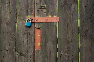 Old garden gate made of wooden planks. Detailed view.