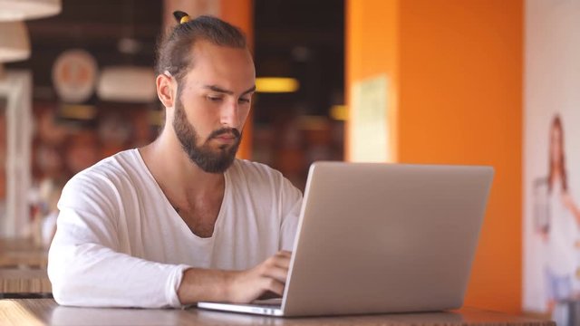 intelligent male freelancer work on notebook