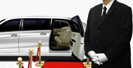 Chauffeur standing by the white limousine
