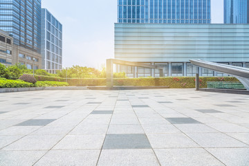 Fototapeta premium empty pavement front of modern office buildings