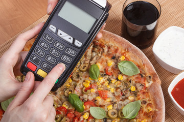 Using payment terminal for paying in restaurant, enter personal identification number, vegetarian...