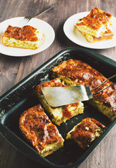 Fresh leek pie on a wooden table