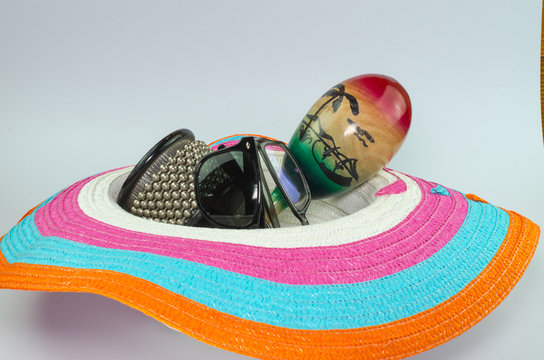 loppy beach hats percussion and sunglasses  in various colors on