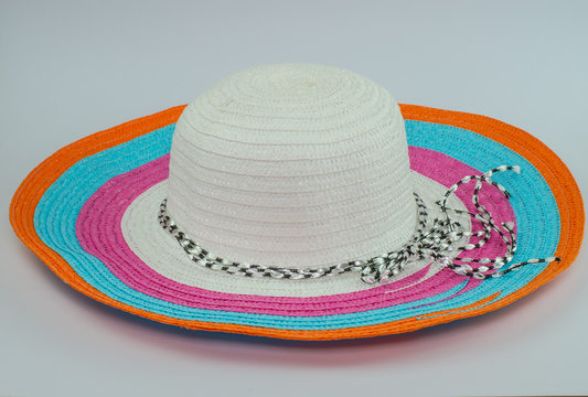 loppy beach hats in various colors on white background