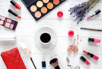 make up set on wooden table with lavender top view