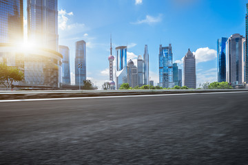 Obraz premium empty asphalt road with cityscape and skyline of Shanghai
