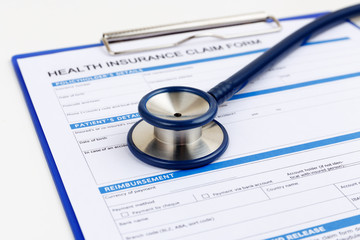 Stethoscope on health insurance claim form