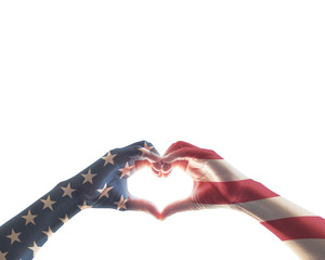 American flag red white blue star pattern on people hands in heart love shape isolated on white background: USA patriot, veterans, independence, Columbus day, constitution and citizenship day concept