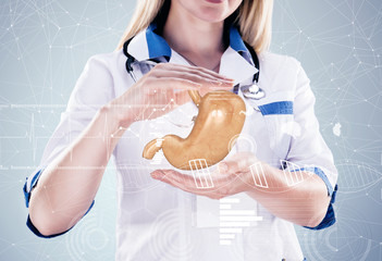 Double Exposure, Doctor with stethoscope and stomach on the hands . gray background.