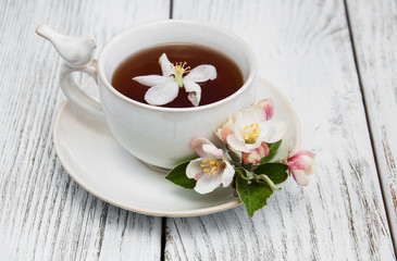 cup of tea with apple blossoms