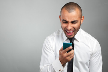 young and black man yelling at the cellphone