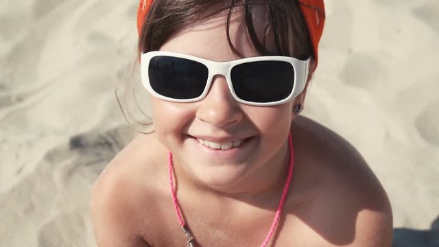 Teenager girl in sunglasses smile