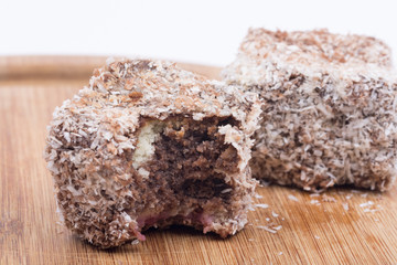 Homemade chocolate cookie with coconut over white background