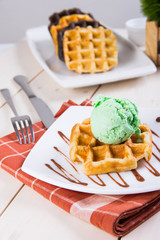belgian waffle with pistachio ice cream on top