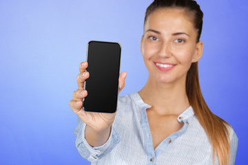 Smiling woman is pointing on smartphone