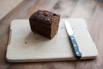 Black bread on the table with knife