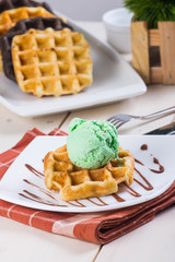 belgian waffle with pistachio ice cream on top