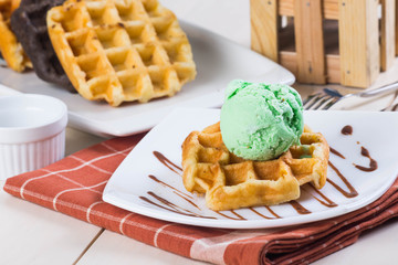 belgian waffle with pistachio ice cream on top