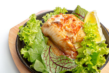 Isolated chicken with vegetable on frying pan
