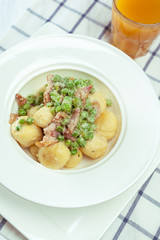 Potato dumplings with fried onion and bacon