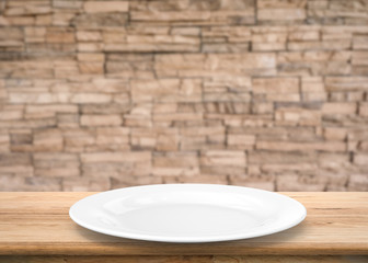 white empty dish on wooden table