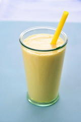 Mango lassi smoothie yellow drink.