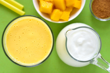 Mango lassi. Mango smoothie made with mango and yogurt, yoghurt. Selective focus. Top view.