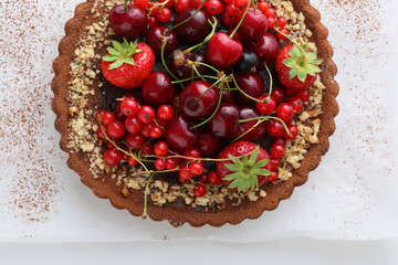 Summer berry tart on white