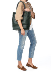 Naklejka premium Woman holding a handbag isolated on white background