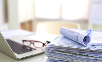 office desk a stack of computer paper reports work forms