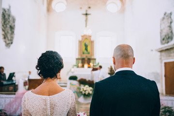 Newlyweds in front of the altar during the wedding ceremony