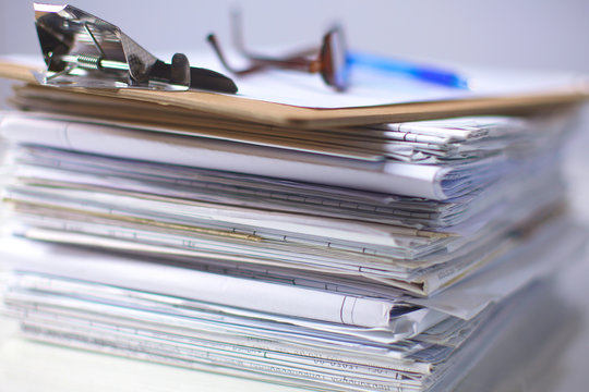 Office Desk A Stack Of Computer Paper Reports Work Forms