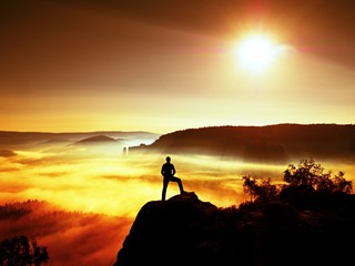 Man silhouette on the sharp peak. Satisfy hiker enjoy view.