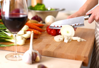 Cook's hands preparing vegetable salad - closeup shot