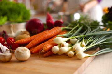 Cook's hands preparing vegetable salad - closeup shot