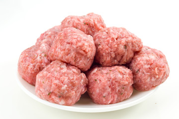 raw meatballs in  porcelain isolated