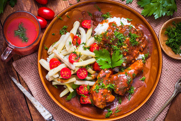 Chicken wings tomato sauce green beans rice