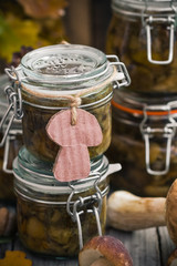 Preparation kitchen mushrooms marinated jars wooden table
