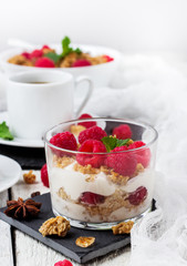 Breakfast concept. Coffee muesli granola berries homemade yogurt