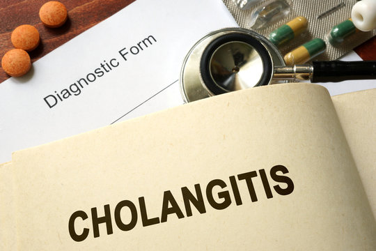 Page with word Cholangitis and glasses. Medical concept.