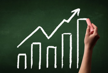 Hand drawing graph on blackboard