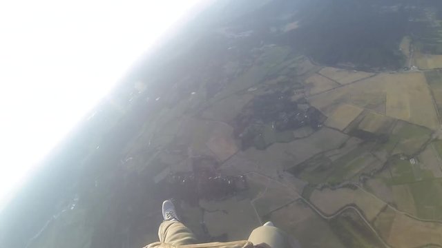 paratrooper jumps out of a plane, disconnect the reserve parachute and flies. first-person view