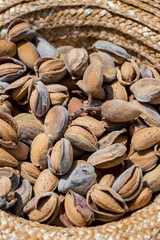 Almonds in a straw hat.