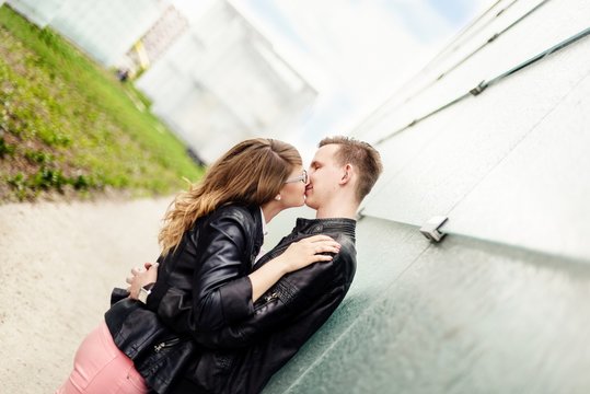 Young couple kissing. Engagement session.